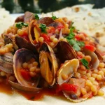 Fregola, pictured here with clams, is a typical Sardinian pasta similar to cous cous buonissimo food fregola with claims sardegna italy issimo