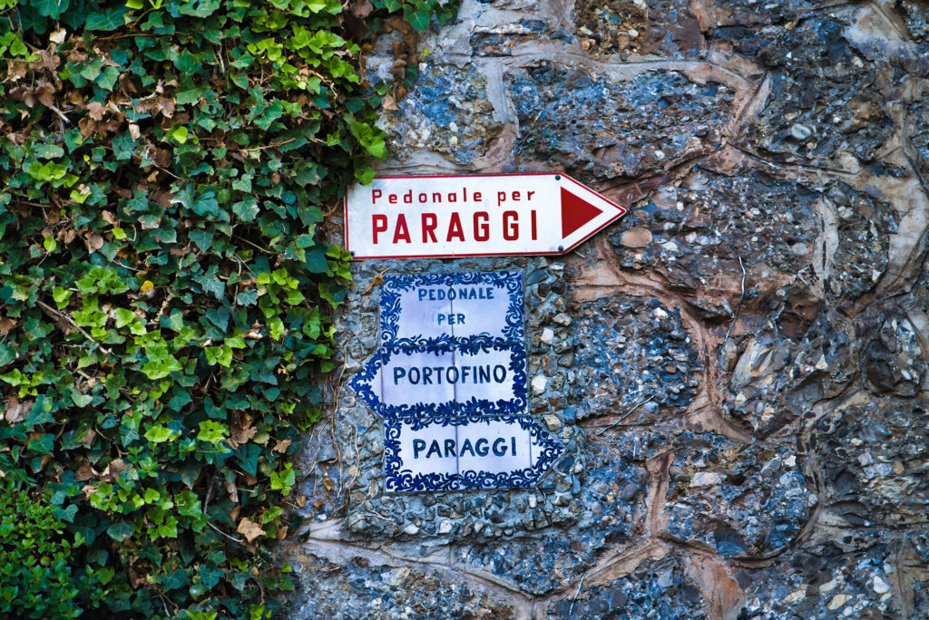 Walking directions on Liguria’s tree covered paths along the coast.