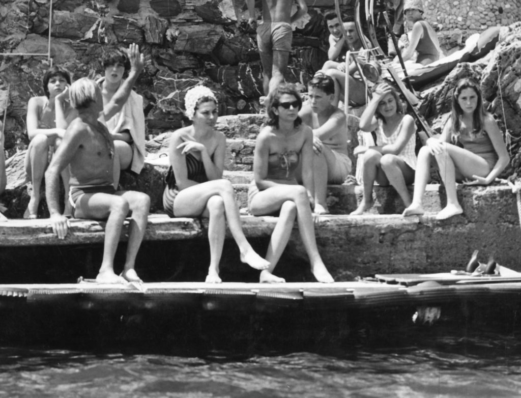 Princess Soraya with friends at a beach club on the Ligurian Coast, 1960.