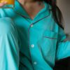 Issimo x Schostal pyjama turquoise & orange, detail fashion