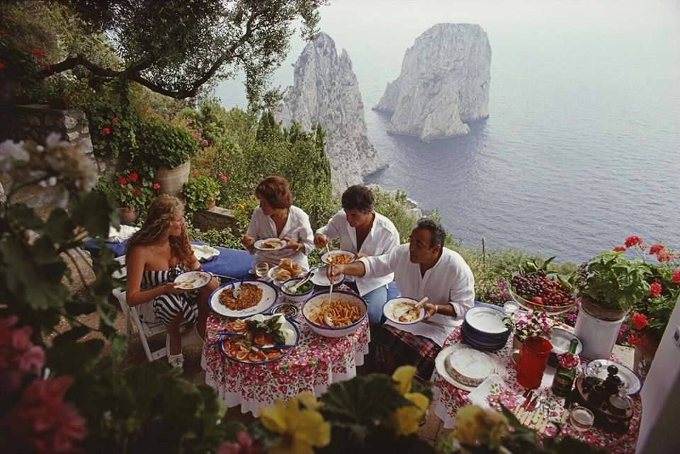 Dinner time in capri by Slim Aarons-