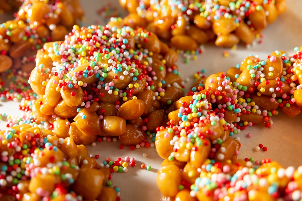Struffoli is a Neapolitan dessert served both at Christmas and New Year's Eve. They are small deep fried balls of sweet shortcrust pastry